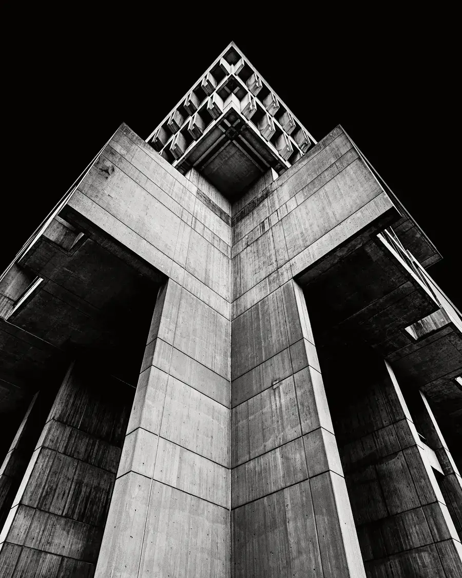 A concrete building in black and white